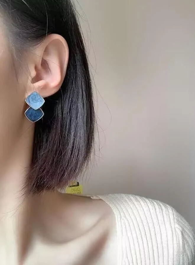 تايك تو أقراطة هندسية على شكل معين